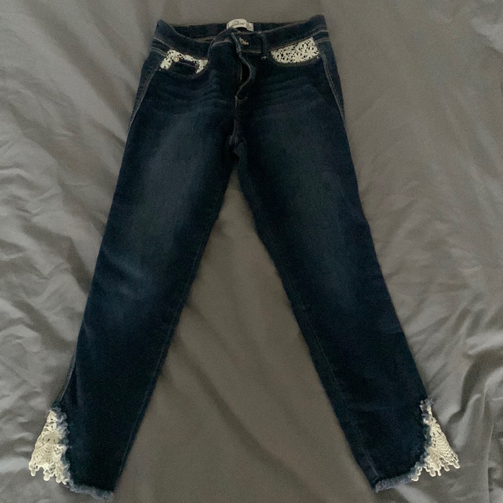 Dark blue jeans with small bottom frays